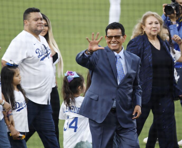 LOS ANGELES, CA - AUGUST 11: Sounded by family Fernando Valenzuela waves to the fans.