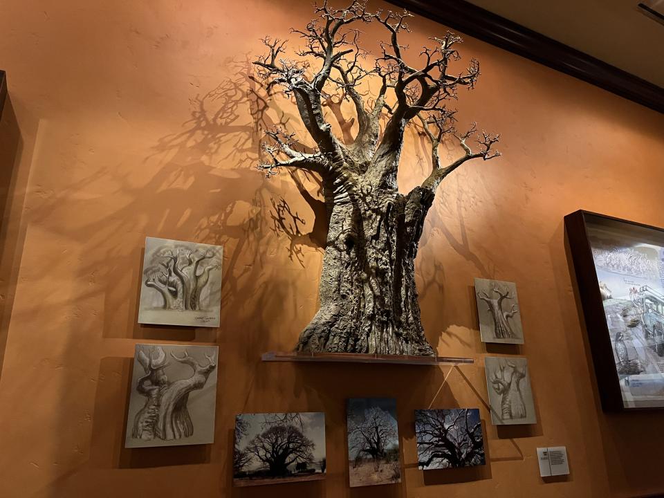 Exhibit of mini tree and small paintings in Safari Gallery dining room.
