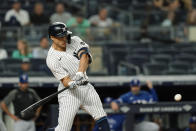 New York Yankees' Giancarlo Stanton hits a home run during the third inning of a baseball game against the Texas Rangers Tuesday, Sept. 21, 2021, in New York. (AP Photo/Frank Franklin II)