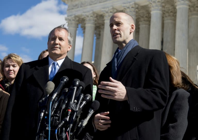 Texas Attorney General Ken Paxton (L) and Texas Soliticor General Scott Keller speak to the media outside of the Supreme Court in Washington, DC, March 2, 2016