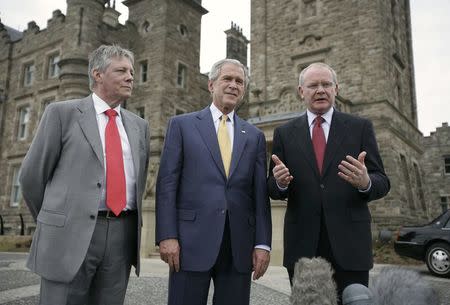 FILE PHOTO - U.S. President George W. Bush (C) is pictured with Northern Ireland's First Minister Peter Robinson (L) and Northern Ireland's Deputy First Minister Martin McGuinness (R) following their meeting at Stormont Castle in Belfast, June 16, 2008. REUTERS/Jason Reed/File Photo