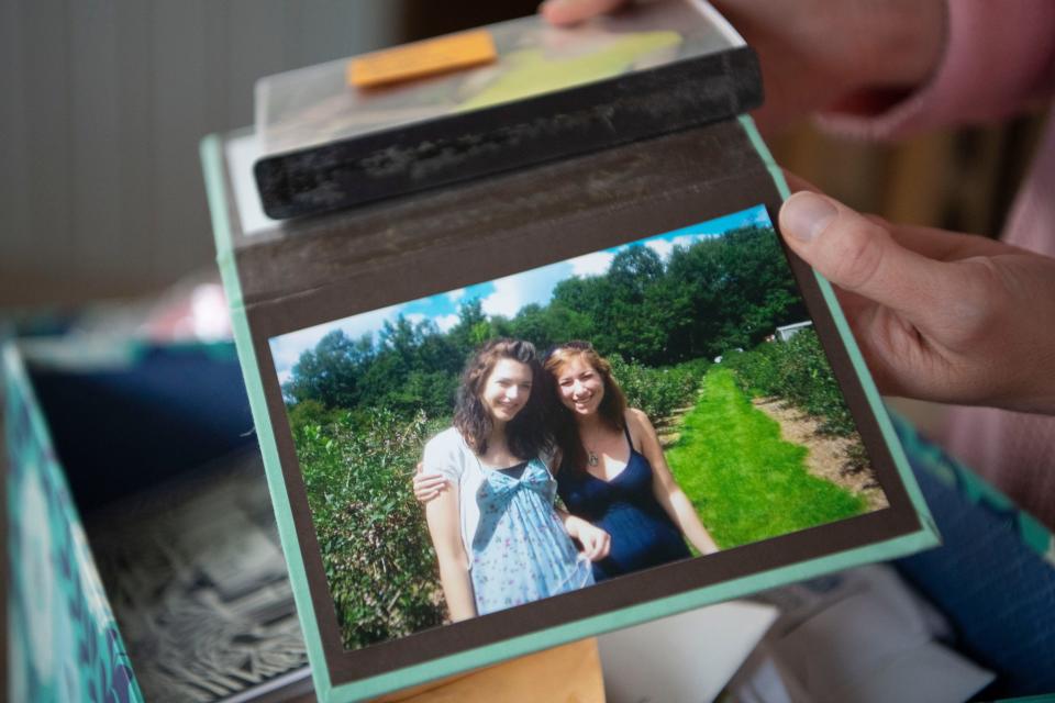 A picture from around 2012 of Nashville screenwriter Audrey Shulman and her dear friend and roommate, Chrissy Osmulski, in California. Shulman is holding the picture on Dec. 5, 2023, in her Nashville home.