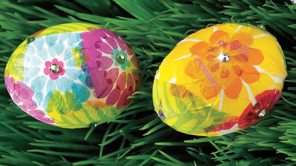 Cool easter egg designs: Two eggs decoupaged eggs decorated with floral-patterned paper napkins and rhinestones