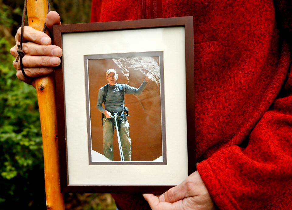 David Cicotello, of Murfreesboro, holds a photograph of his older brother Louis Cicotello. Louis Cicotello fell to his death during a day hike that the two went on. After the fall David Cicotello survived six days stranded in a slot canyon in Utah in 2011, before he was rescued.