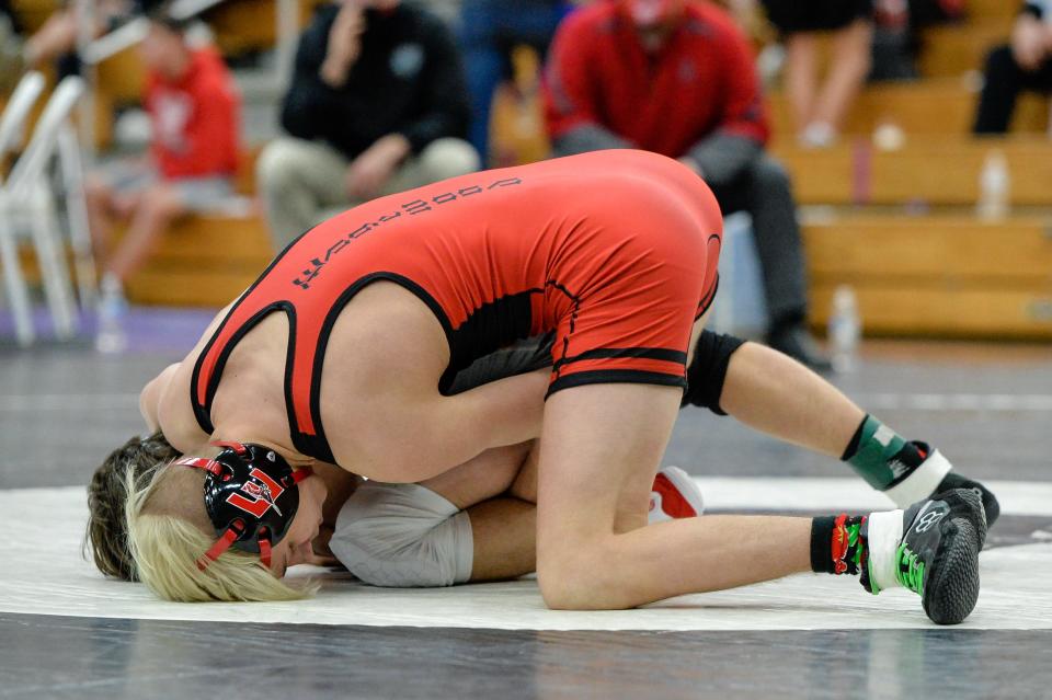 Edgewood’s Cash Turner defeats Terre Haute South Vigo’s Harrison May by a major decision in the wrestling regional at Bloomington South.