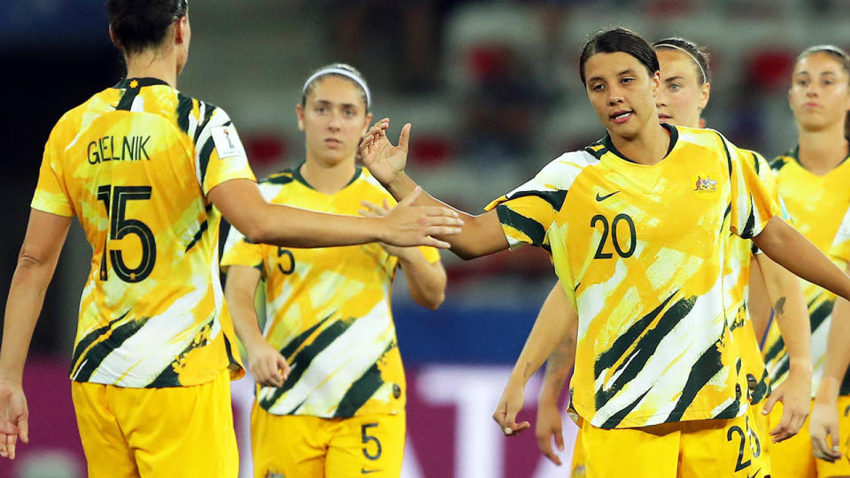 Emily Gielnik is consoled by Sam Kerr. (Photo by Richard Heathcote/Getty Images)