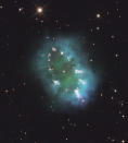 In this image taken July 2, 2011 provided by NASA Thursday Aug. 11, 2011 a giant cosmic necklace glows brightly in this Hubble Space Telescope image. The object, aptly named the Necklace Nebula, is a recently discovered planetary nebula, the glowing remains of an ordinary, Sun-like star. The Necklace Nebula is located 15,000 light-years away in the constellation Sagitta. (AP Photo)