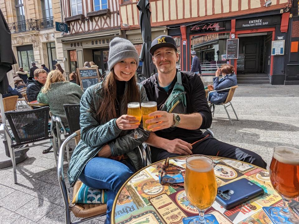 sarah kuta and partner having a beer in france
