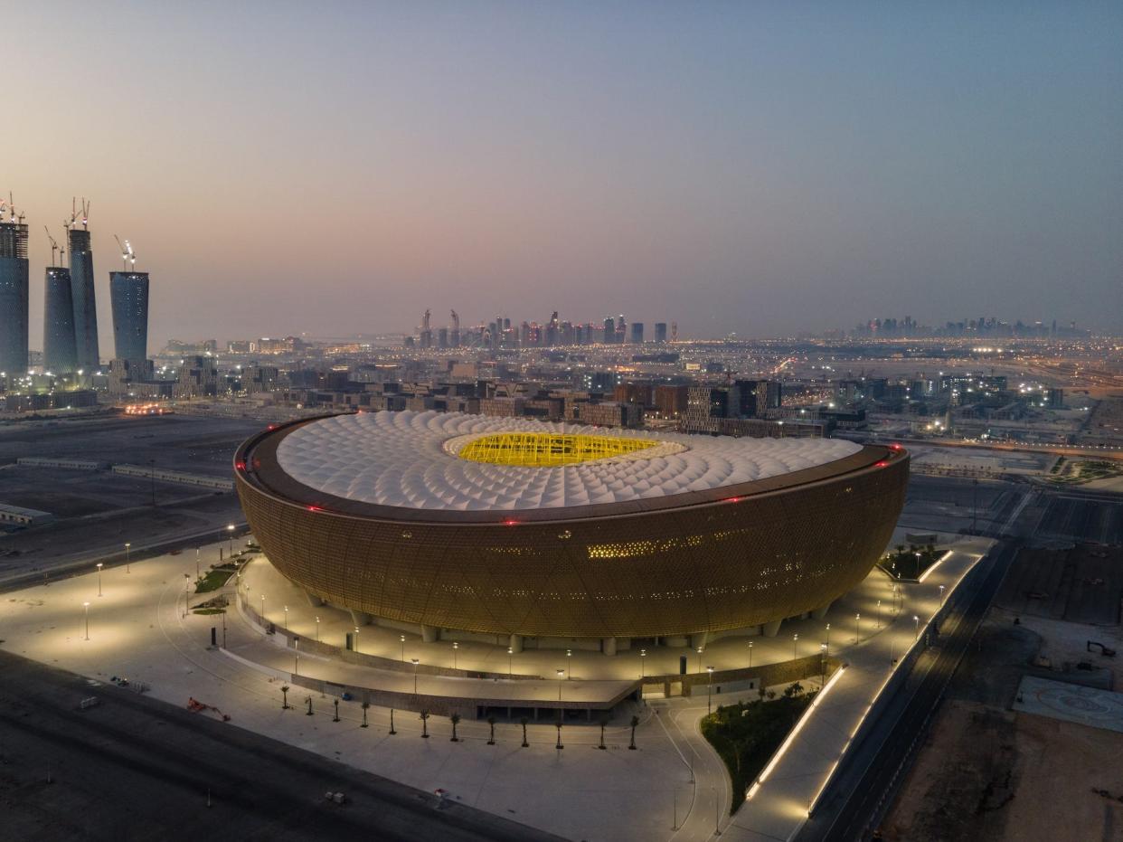 An aerial view of Lusail Stadium at sunrise on June 20, 2022 in Doha, Qatar. The 80,000-seat stadium, designed by Foster + Partners studio, will host the final game of the FIFA World Cup Qatar 2022.