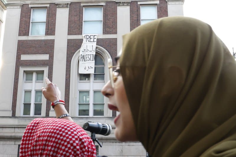 Pro-Palestine protesters march in front the Hamilton Hall building at Columbia University on Tuesday. The university's president said Wednesday she was “sorry we reached this point.” Photo by John Angelillo/UPI