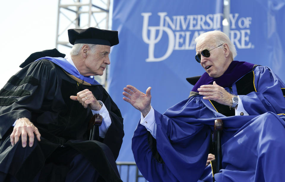 FILE - President Joe Biden speaks with Sen. Tom Carper, D-Del., during the University of Delaware Class of 2022 commencement ceremony in Newark, Del., Saturday, May 28, 2022. Carper announced Monday, May 22, 2023, that he will not seek reelection to a fifth term in the U.S. Senate. (AP Photo/Manuel Balce Ceneta, File)