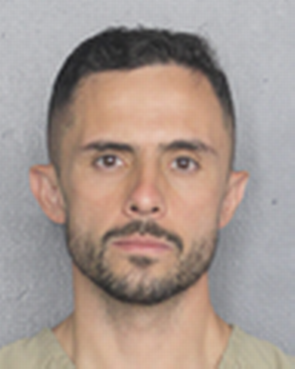 Heriberto Martinez, 36, the former associate director of engineering at Jackson Health Systems, was taken into custody in Broward County Tuesday morning and is charged with taking part in a scheme in which he exchanged construction jobs for cash, trips and football tickets.