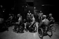 Wheelchair athletes wait their turn to take the stage at the wheelchair bodybuilding pro show in Houston. (Photo by Lauren Fleishman for TIME) <br> <br> <a href="http://lightbox.time.com/2012/10/15/wheelchair-bodybuilders/#1" rel="nofollow noopener" target="_blank" data-ylk="slk:Click here to see the full collection and story at TIME.com;elm:context_link;itc:0;sec:content-canvas" class="link ">Click here to see the full collection and story at TIME.com</a>