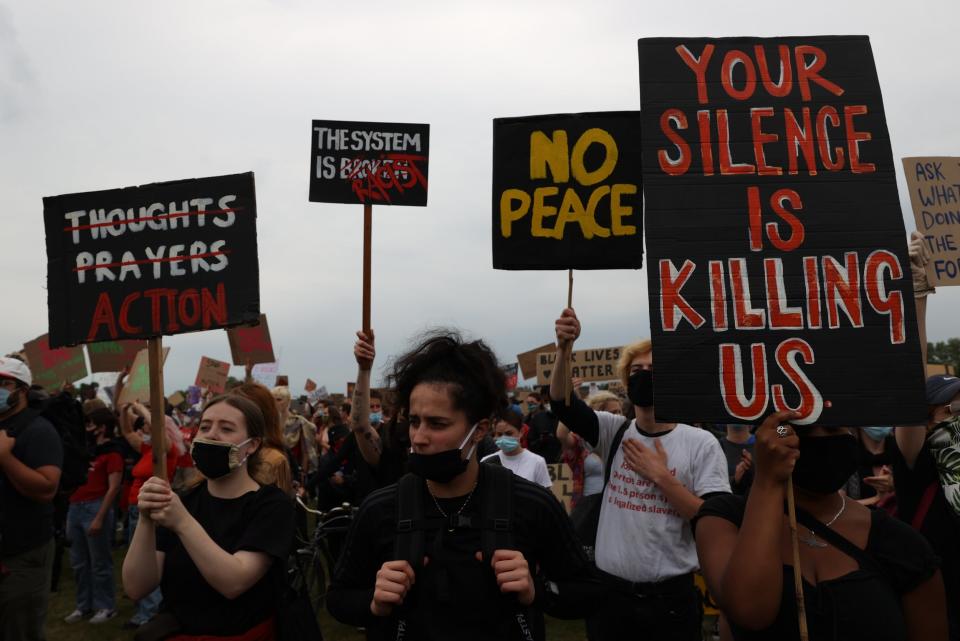 Placards at the Hyde Park protest demanded action as actor John Boyega gave an impassioned speech (Nigel Howard)