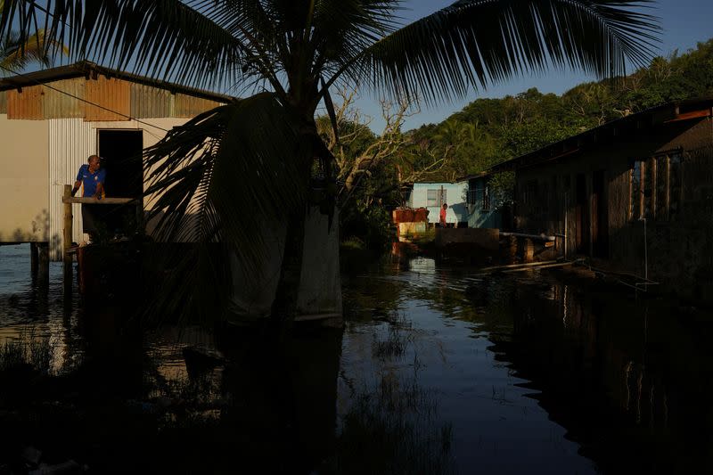 The Wider Image: Rising sea levels are forcing Fiji's villagers to relocate. They want polluters to pay instead