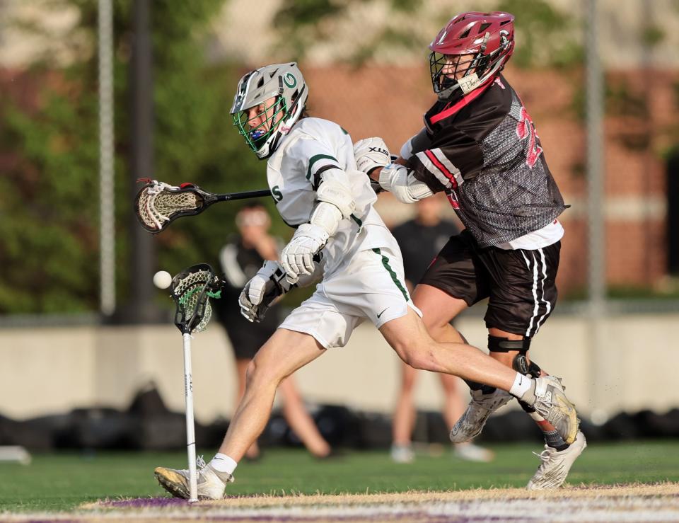 Olympus’ Gage Phippen, loses his stick after Northridge’s Cache Peterson hit it as they play in semifinal lacrosse action at Westminster in Salt Lake City on Wednesday, May 24, 2023. | Scott G Winterton, Deseret News