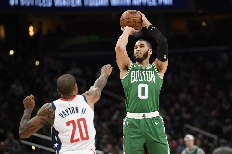 Boston Celtics forward Jayson Tatum (0) shoots over Washington Wizards guard Gary Payton II (20) during the second half of an NBA basketball game, Monday, Jan. 6, 2020, in Washington. The Wizards won 99-94. (AP Photo/Nick Wass)