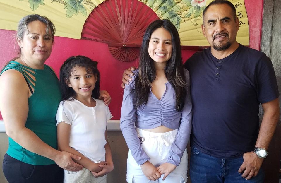 The Jimenez family enjoys China Palace Restaurant. From left Maricella, Mia, Michelle and China Palace owner Luis Jimenez.