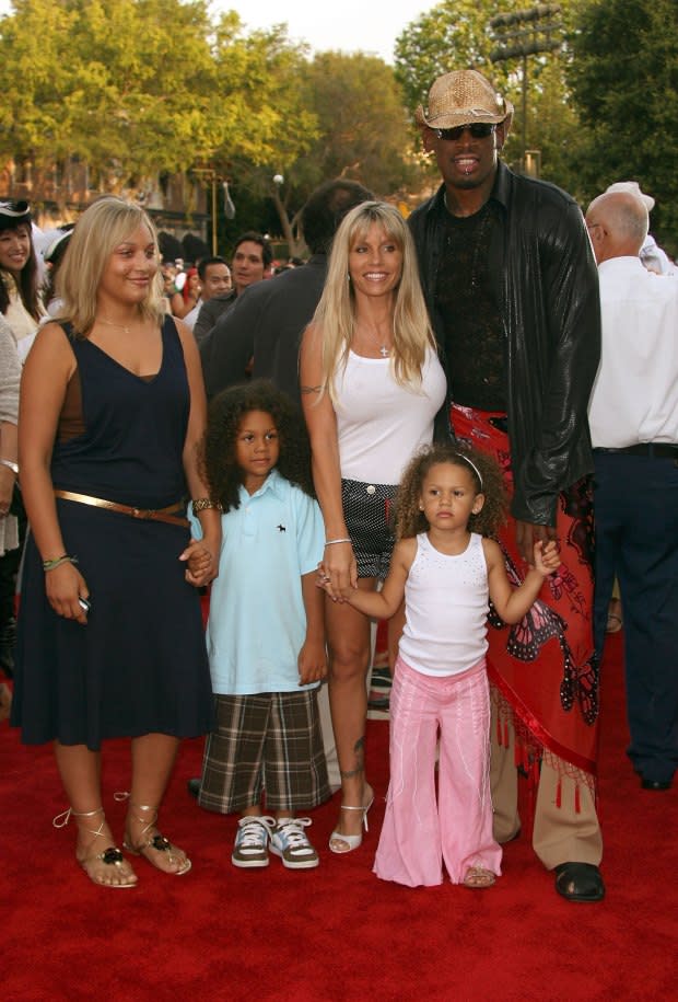 Alexis Rodman, Dennis "D.J." Rodman, Michelle Moyer, Trinity Rodman and Dennis Rodman in 2006<p><a href="https://www.gettyimages.com/detail/news-photo/actor-dennis-rodman-with-wife-michelle-moyer-and-kids-news-photo/71290723" rel="nofollow noopener" target="_blank" data-ylk="slk:Frederick M. Brown/Getty Images;elm:context_link;itc:0;sec:content-canvas" class="link ">Frederick M. Brown/Getty Images</a></p>