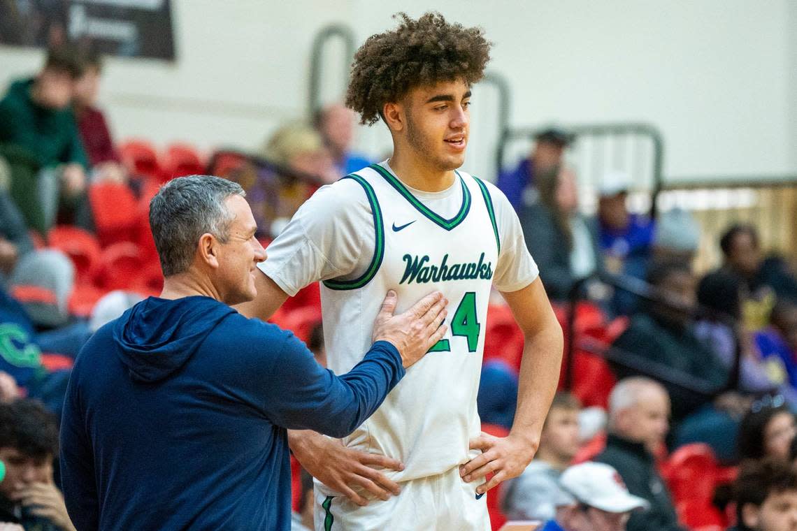 Great Crossing head coach Steve Page talks with Malachi Moreno during a Warhawks game this season. The 7-foot-1 Moreno is a top-40 national recruit.