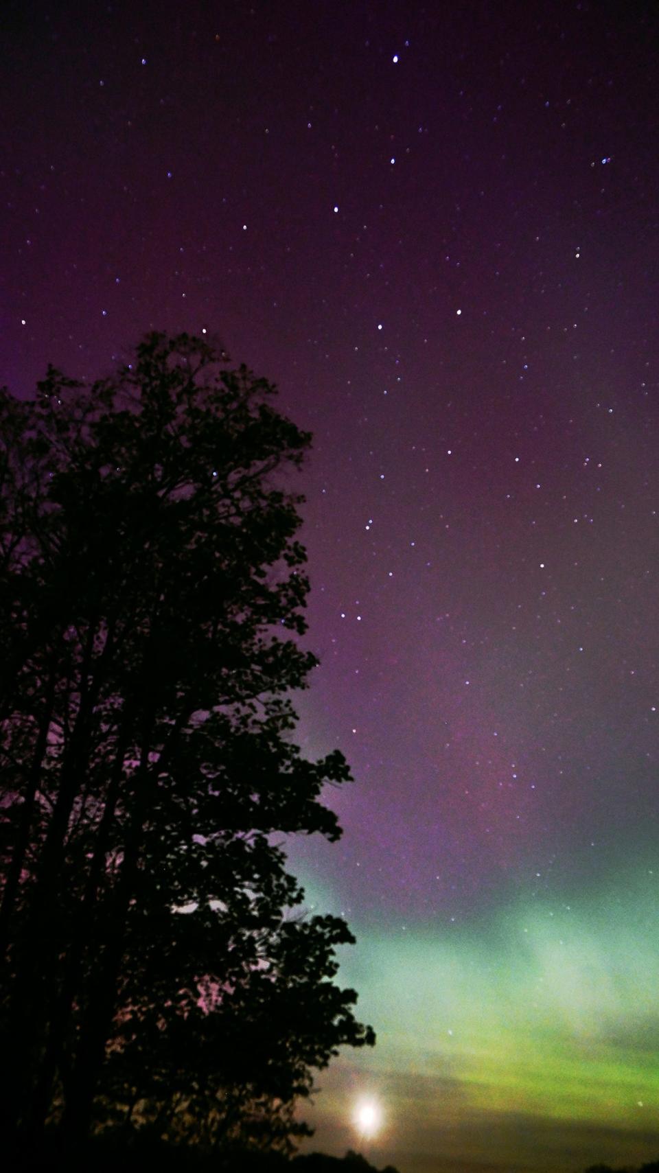 The northern lights are seen overhead at Nub's Nob in Harbor Springs at 12:30 a.m. on May 12, 2024.