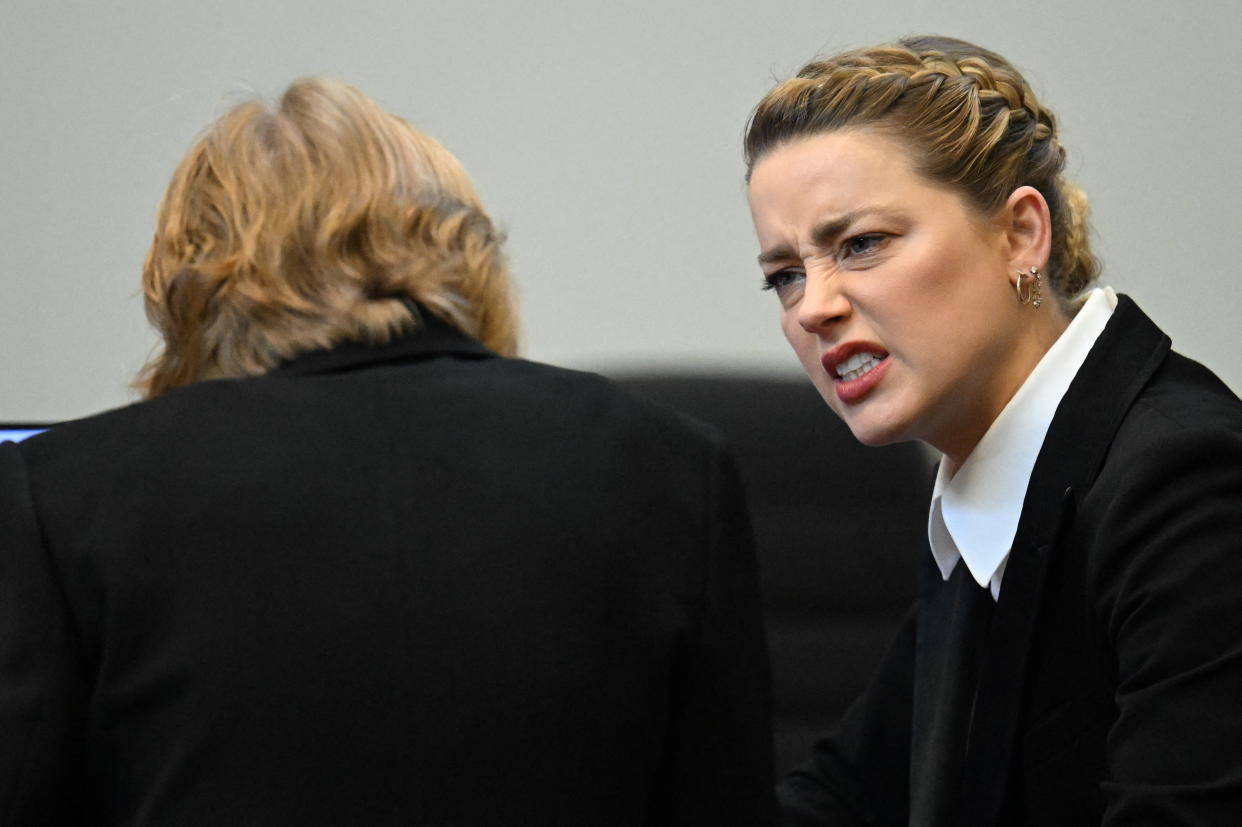 Amber Heard reacts in the courtroom on day 12 of witness testimony as Johnny Depp is suing her for defamation