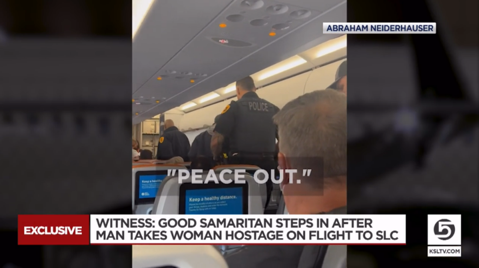 A passenger travelling on a flight from New York to Salt Lake City held a woman hostage with a razor blade before a Good Samaritan managed to talk him down (KSLTV/video screengrab)