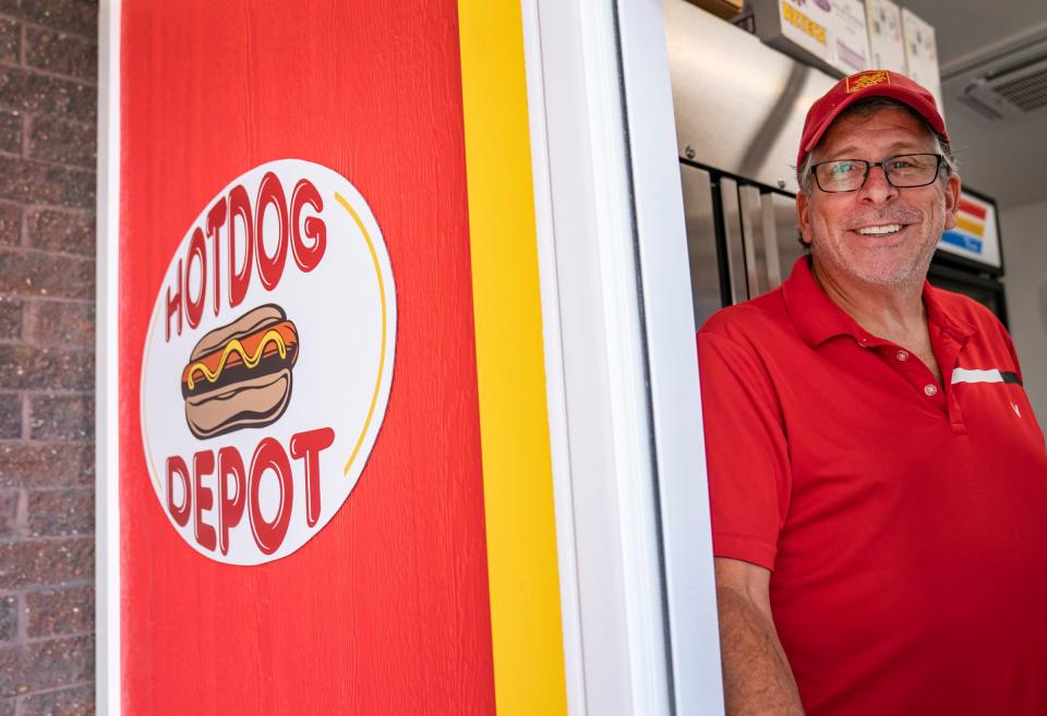 Hotdog Depot stand owner Rick Kagen poses at his new hot dog stand at the Madison Heights Home Depot on 12 Mile that is serving up dogs again outside in a new built-in stand on Monday, Sept. 11, 2023.