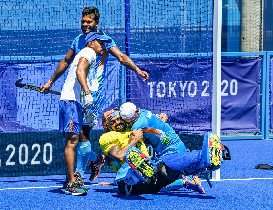 <div class="paragraphs"><p>India's Sreejesh and Mandeep hug each other as they celebrate their victory over Germany in the men's field hockey bronze medal match at the Tokyo Olympics.</p></div>