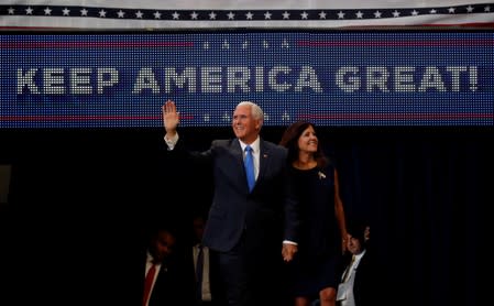 U.S. Vice President Mike Pence and his wife Karen Pence react during a campaign rally for U.S. President Donald Trump in Orlando
