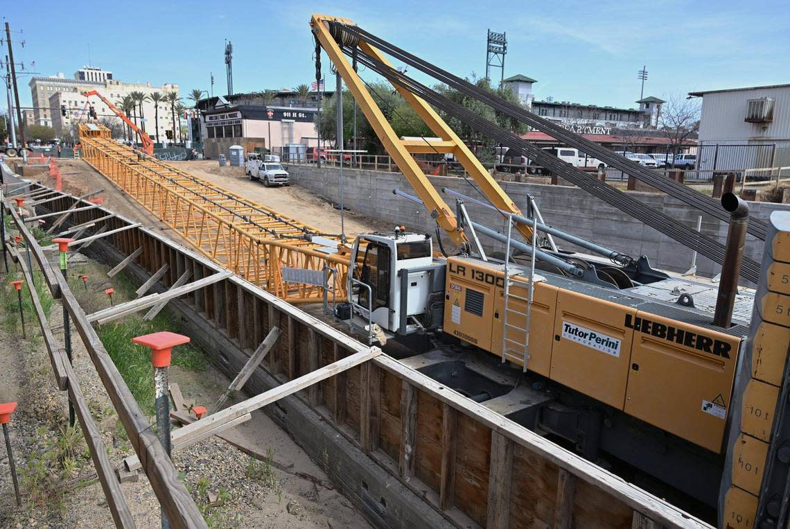 A large crane is shown being assembled at construction site for the Tulare Street underpass for high-speed rail on Friday, March 22, 2024 in downtown Fresno.