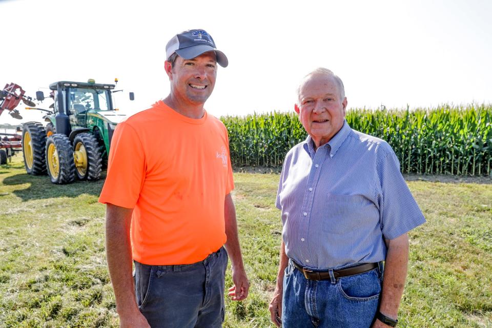 Father and son farmers, John Hardin, right, and David Hardin, left, stand on the property of their family farm in Danville Ind., on Wednesday, Aug. 7, 2019. The Hardin's, who own farmland in Hendricks and Putnam counties, raise hogs, corn, soybeans and winter wheat, are affected by escalating tensions in the U.S.-China trade war. 