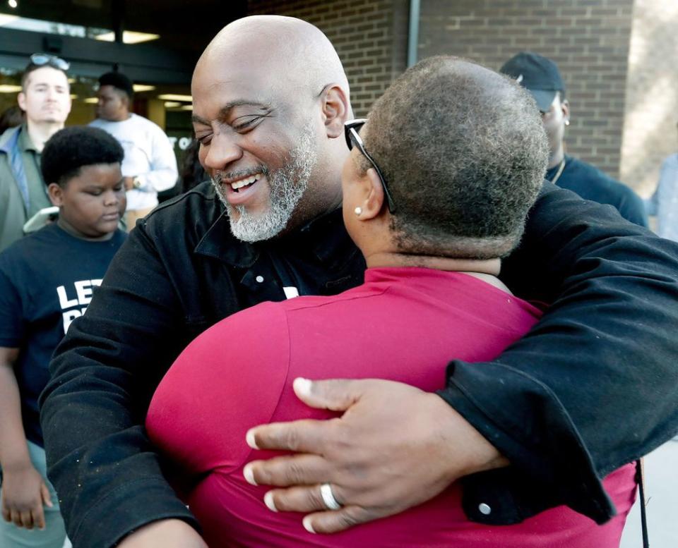 Desmond Meade hugs a fellow activist