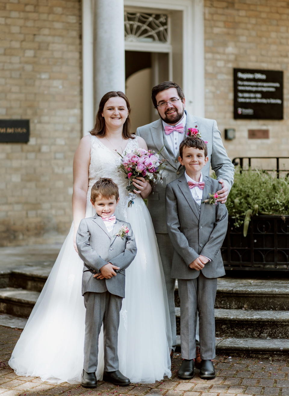 Vicky Payne and husband Kyle on their wedding day with their two children, Casper, 10 and Marley, 7. (Joanna Ranson Photography/SWNS)