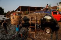 The Wider Image: Cash for trash: Indonesia village banks on waste recycling