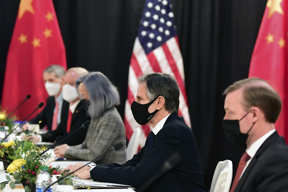 Secretary of State Antony Blinken, second from right, joined by national security adviser Jake Sullivan, right, listen as they meeti Chinese Communist Party foreign affairs chief Yang Jiechi and China's State Councilor Wang Yi at the opening session of US-China talks at the Captain Cook Hotel in Anchorage, Alaska, Thursday, March 18, 2021. (Frederic J. Brown/Pool via AP)