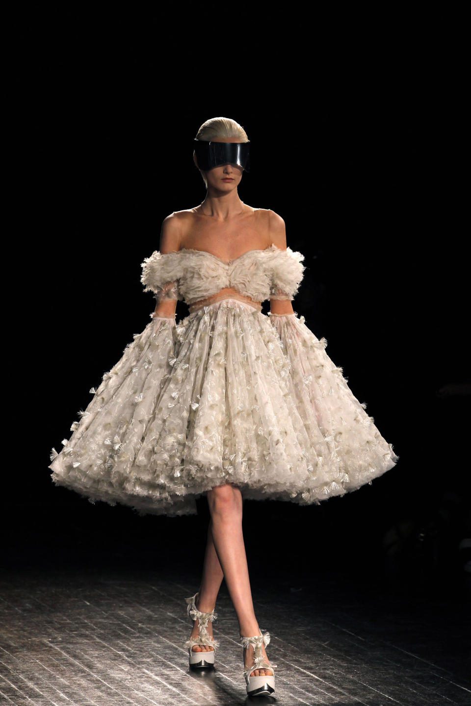 A model wears a creation by British designer Sarah Burton for Alexander McQueen as part of the Fall-Winter, ready-to-wear 2013 fashion collection, during Paris Fashion week, Tuesday, March 6, 2012. (AP Photo/Christophe Ena)