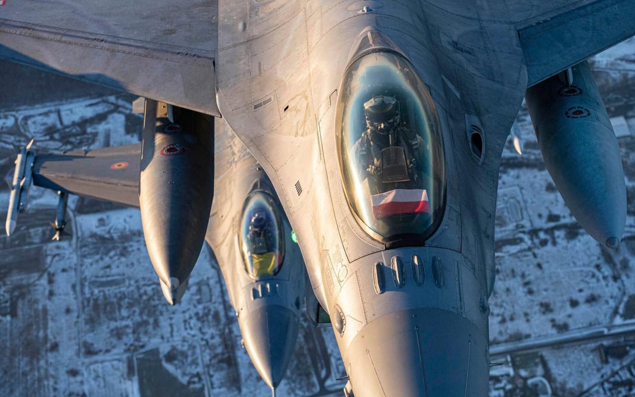 A Polish Air Force F-16 fighter jet participating in NATO's Baltic Air Policing Mission operate in Lithuanian airspace today - Lithuanian Ministry of National Defence via AP