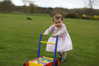 The little Princess having a ball in the garden.