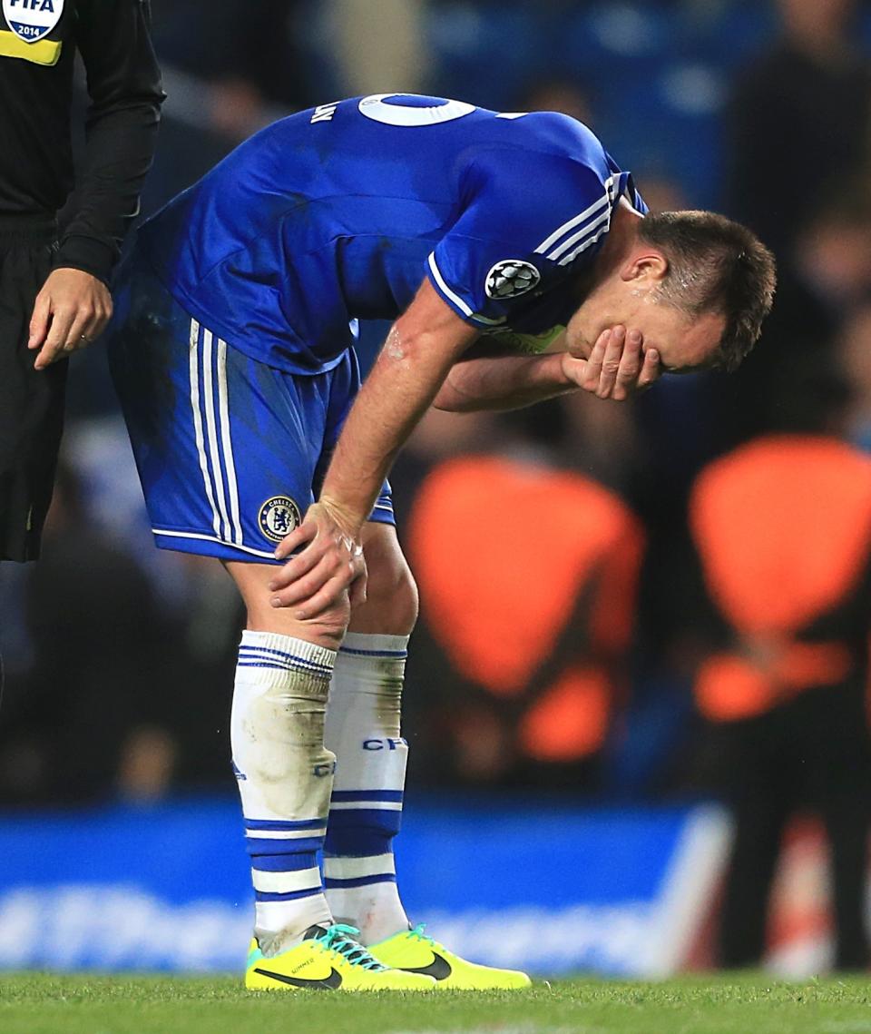 Chelsea's John Terry looks dejected at the end of the Champions League semifinal second leg soccer match between Chelsea and Atletico Madrid at Stamford Bridge Stadium in London, Wednesday, April 30, 2014. (AP Photo/Nick Potts, PA Wire) UNITED KINGDOM OUT - NO SALES - NO ARCHIVES