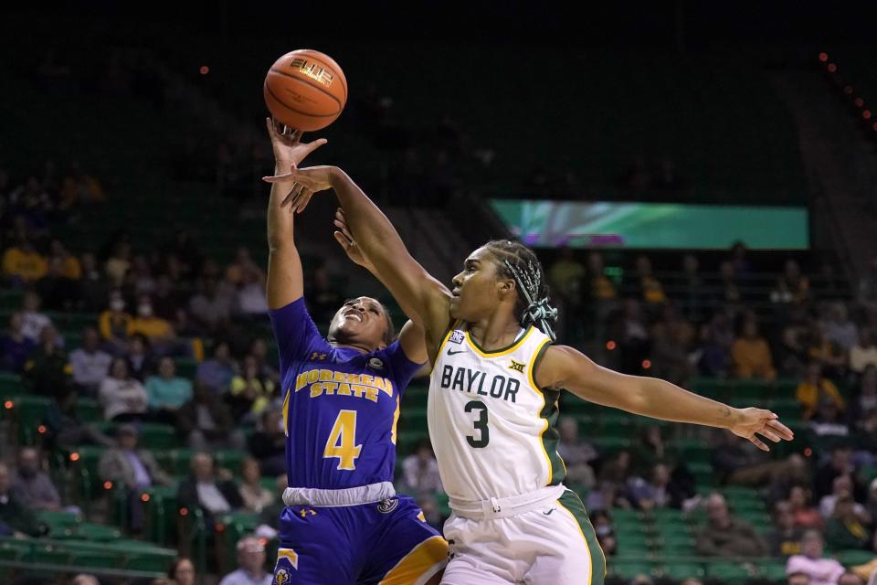 Morehead State guard Morgan Browning (4) is fouled by Baylor guard Jordan Lewis (3) during the first half of an NCAA college basketball game in Waco, Texas, Tuesday, Nov. 30, 2021. (AP Photo/Tony Gutierrez)