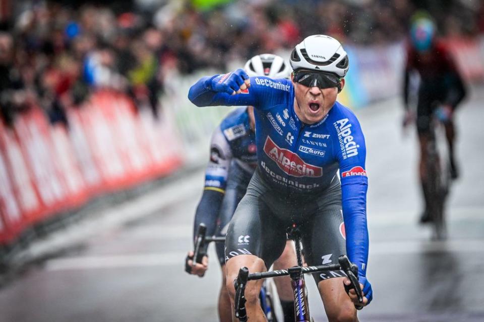 AlpecinDeceunincks Belgian rider Jasper Philipsen celebrates after crossing the finish line to win the mens elite race of the Classic BruggeDe Panne oneday cycling race 2074km from Brugge to De Panne on March 22 2023 Photo by ERIC LALMAND  Belga  AFP  Belgium OUT Photo by ERIC LALMANDBelgaAFP via Getty Images