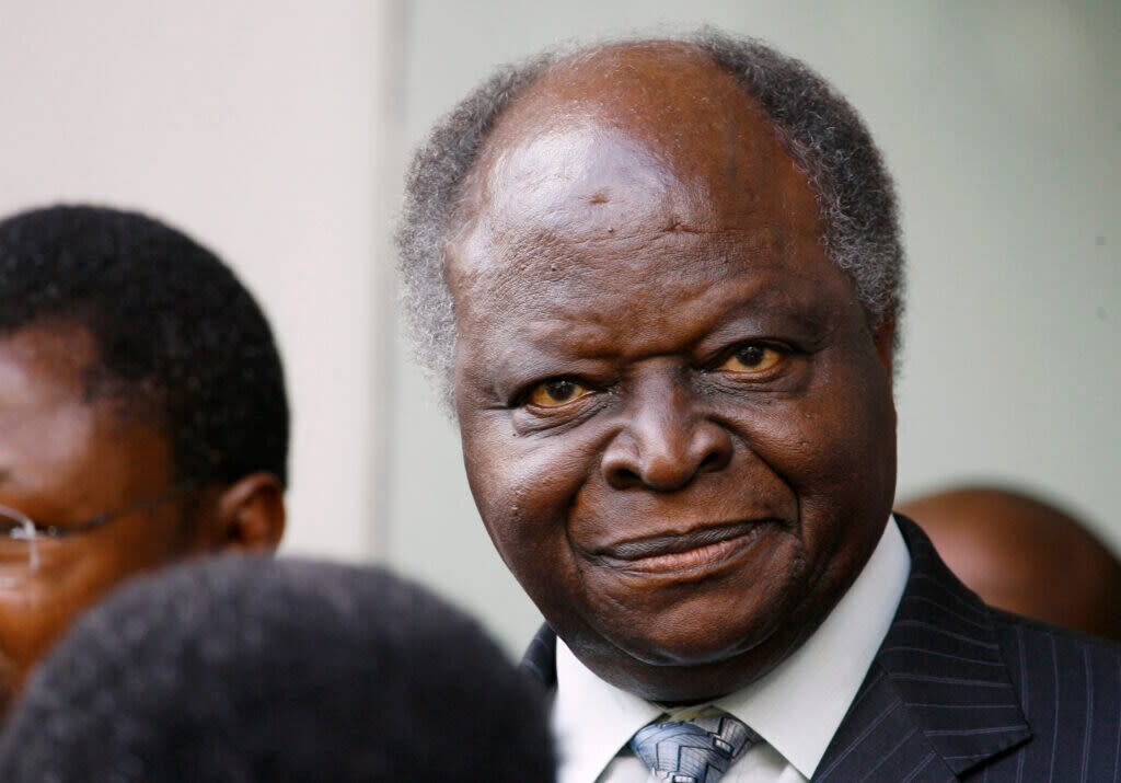 Former Kenyan President Mwai Kibaki listens to former U.N Secretary General Kofi Annan after signing a power-sharing agreement with opposition leader Raila Odinga to end the country’s deadly post-election crisis, in Nairobi, Feb. 28, 2008.(AP Photo/Jerome Delay, file)