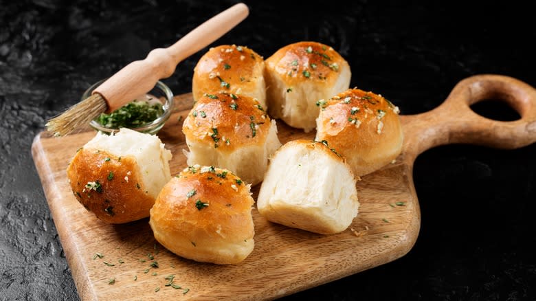 garlic buns on wooden board