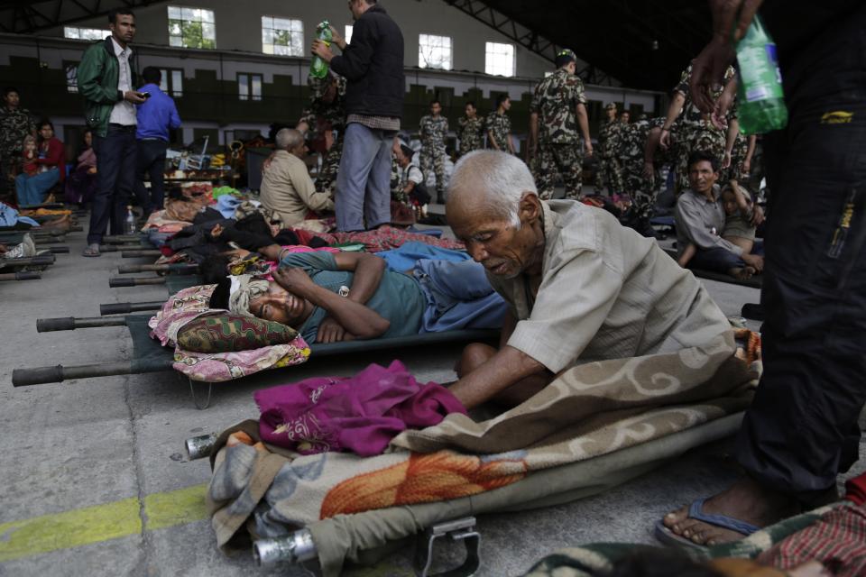 Victims Saturday's earthquake wait for ambulances after being evacuated at the airport in Kathmandu, Nepal, Monday, April 27, 2015.  (AP Photo/Altaf Qadri)