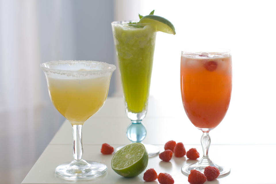 This April 2, 2012, photo made in Concord, N.H., shows three cocktails for a Cinco de Mayo celebration. (AP Photo/Matthew Mead)