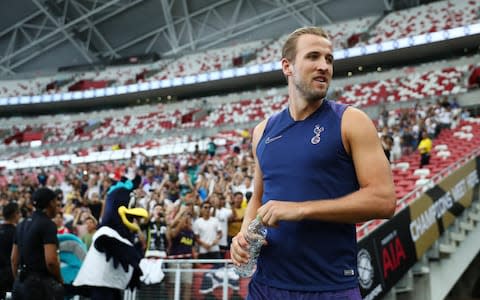 Harry Kane makes his way to the pitch during the Tottenham Hotspur official training/press conference at the Singapore National Stadium  - Credit: Getty Images