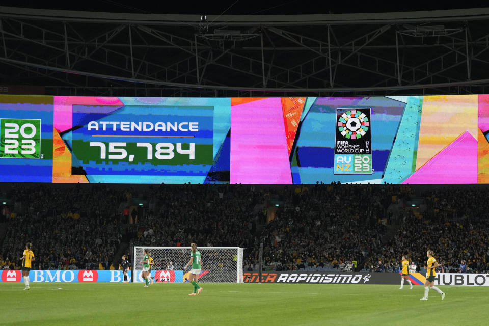 Screens show the number of attendances during the Women's World Cup soccer match between Australia and Ireland at Stadium Australia in Sydney, Australia, Thursday, July 20, 2023. (AP Photo/Rick Rycroft)