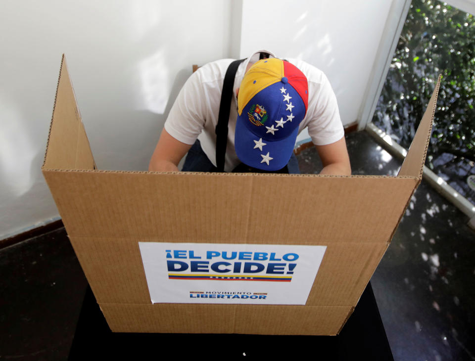 Venezuelans cast ballots in symbolic opposition vote