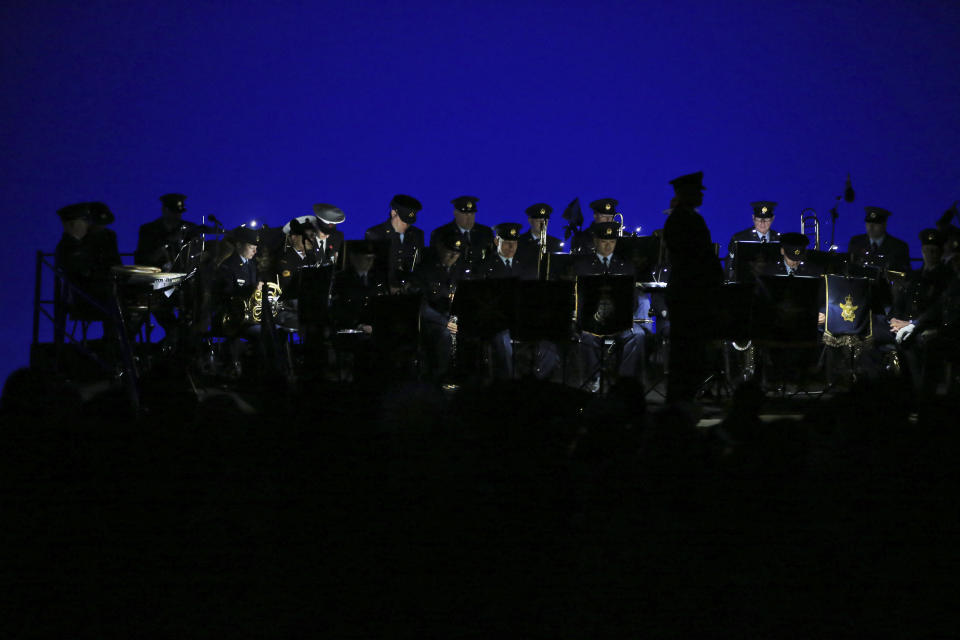 Army officers observe a minute of silence during the Dawn Service ceremony at the Anzac Cove beach, the site of World War I landing of the ANZACs (Australian and New Zealand Army Corps) on April 25, 1915, in Gallipoli peninsula, Turkey, early Thursday, April 25, 2019. As dawn broke, families of soldiers, leaders and visitors gathered near former battlefields, honouring thousands of Australians and New Zealanders who fought in the Gallipoli campaign of World War I on the ill-fated British-led invasion. The doomed Allied offensive to secure a naval route from the Mediterranean to Istanbul through the Dardanelles, and take the Ottomans out of the war, resulted in over 130,000 deaths on both sides.(AP Photo/Emrah Gurel)